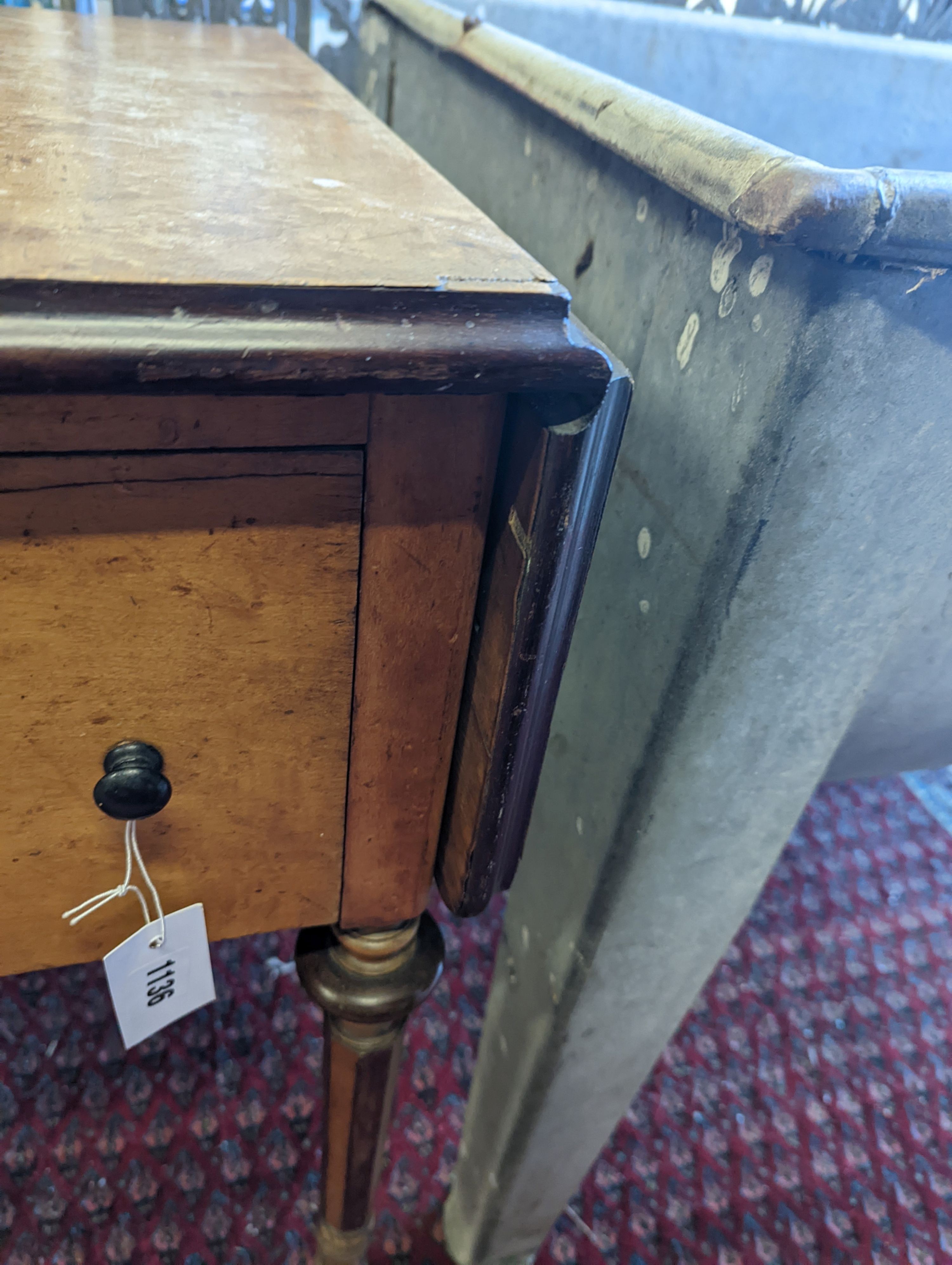 A 19th century Continental bird's eye maple drop flap work table, width 38cm, depth 53cm, height 74cm